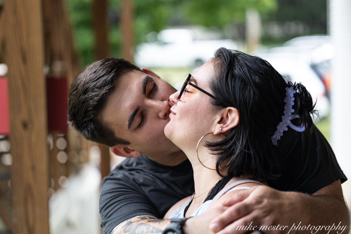 Couple sharing a kiss during an outdoor photography session