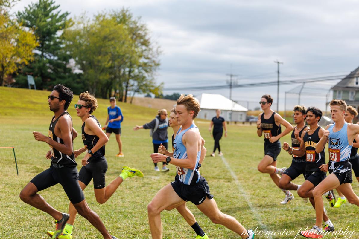 Cross-country runners competing together on the course