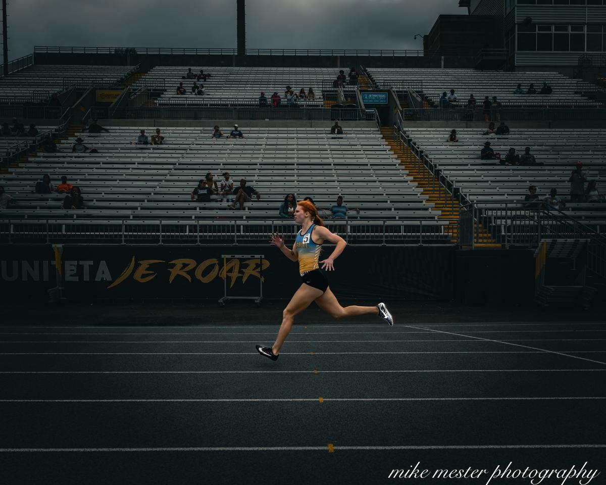 Track athlete competing in a stadium race